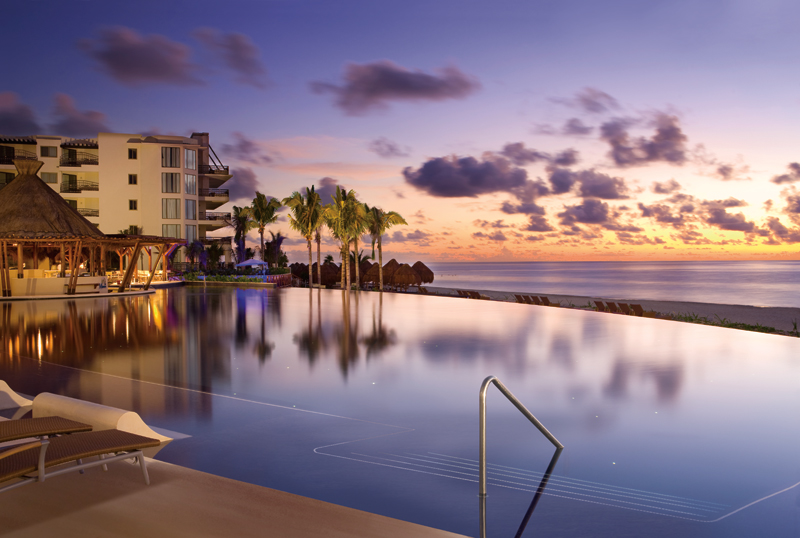 Dreams Riviera Cancun infinity pool at dusk